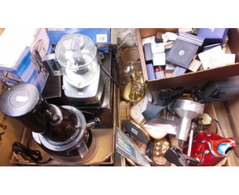 A box of kitchen electrical accessories; juicers + attachments, whisks, etc. together with a box of ornaments, clock, video c