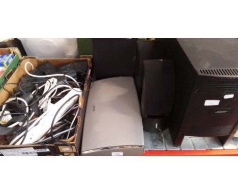 A Bose AV20 control console with a Bose speaker system, model PS18 together with a box of cables and Bose mini speakers. 