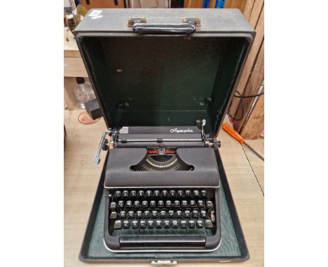 A vintage Olympia  portable typewriter. 