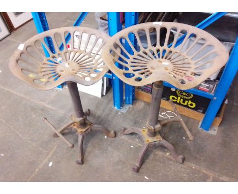 Two tractor seats repurposed as bar stools. 