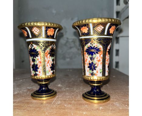 A pair of Royal Crown Derby small vases, pattern 1051, approx height 10.5 cmCondition:- Good, no sign of any other damage or 