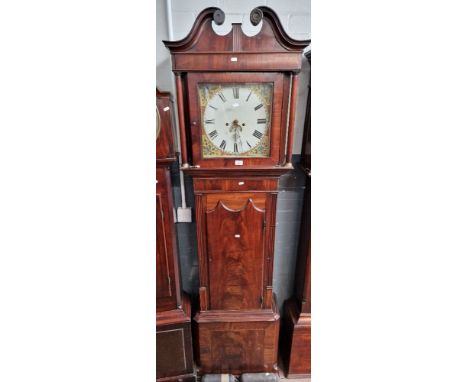 A George III mahogany longcase clock with weights and pendulum. 