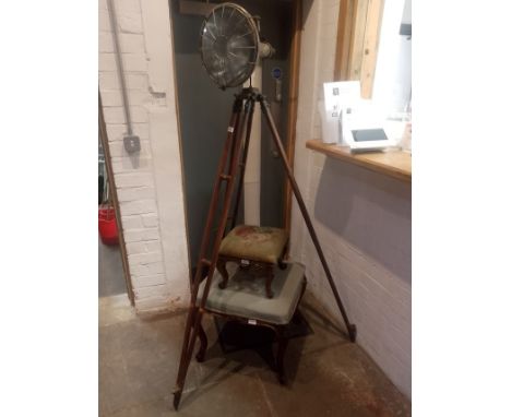 A vintage lamp on tripod base. 