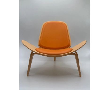 The Hans Wegner Shell Chair, also known simply as the "Shell Chair," is a classic and iconic piece of modern furniture design