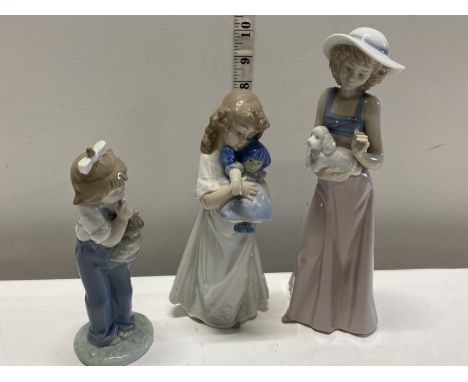 Three assorted Nao figurines 