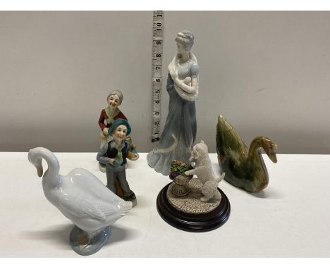 A selection of assorted figurines including Nao and Country Artists 