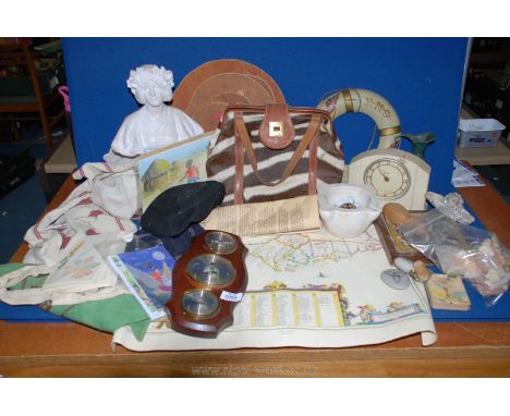 A box of miscellanea to include Smiths Bakelite clock, wooden animal table mats, Zebra skin handbag, maps, small wooden HMS C