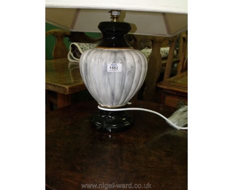 A large ribbed pottery Lamp and square shade.