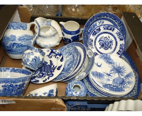 A quantity of blue and white china including jugs, willow pattern plates, Copeland Spode and Burleigh ware, bowls, side plate