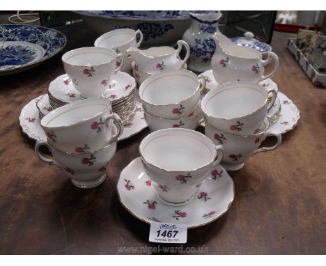 A Colcough part tea service, with pink rose and gold rim pattern, to include; ten cups and saucers, ten side plates, two brea