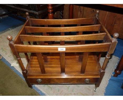 A heavy Mahogany Canterbury having three compartments and a frieze drawer below with brass/ormolu drop ring handles and stand