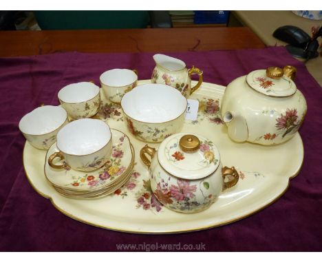 A superb Royal Worcester blush ivory Teaset comprising of; teapot, sucrier, slop bowl, jug, four cups and saucers and a large