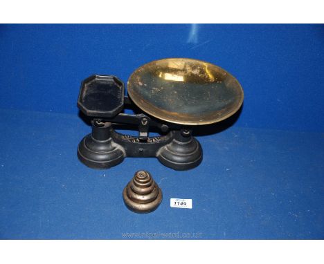 A set of weighing scales with Imperial weights.