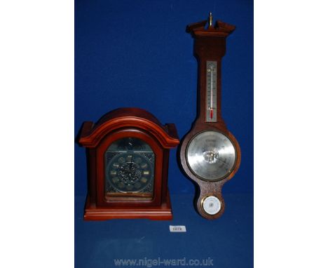 A Bentima battery clock and a Comitti of London Barometer.