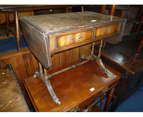 An older reproduction sofa table style Occasional Table standing on four turned supports on reeded splay feet terminating in 