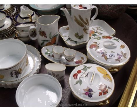 A quantity of Royal Worcester 'Evesham' china to include; two tureens (one small, one large), a jug, egg cups, flan dishes, c