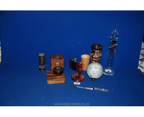 Two wooden games, a miniature miner's lamp, treen dice shaker, letter opener, Galileo thermometer, etc.