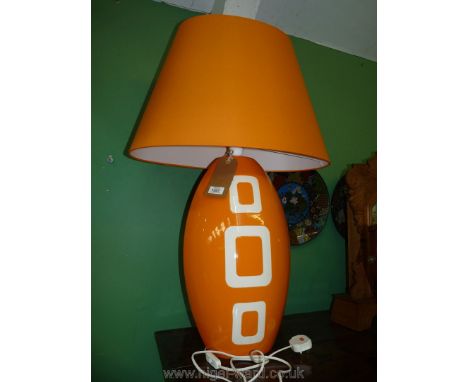 A large orange Louis Drimmer table Lamp and matching shade. the base 26" tall, with shade 33" overall