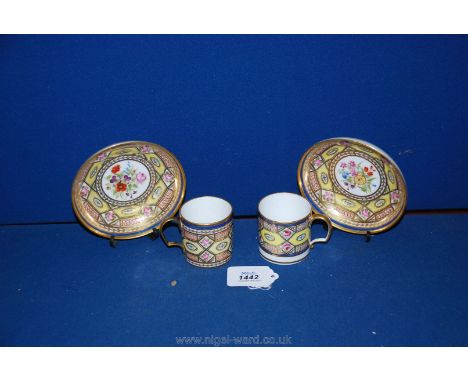 An interesting pair of hard paste coffee cans and saucers, possibly Paris but finely decorated in the Sevres style of the 178
