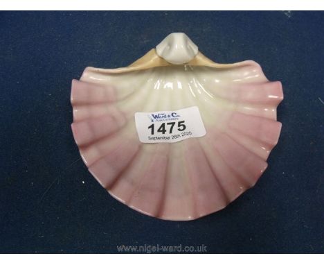 A Royal Worcester blush porcelain shell trinket dish in blush and pin, date code indistinct, G172,  3" x 3 1/2".