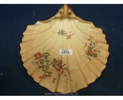 A Royal Worcester China Works porcelain shell shaped Dish, blush ivory ground with floral decoration, standing on three feet,