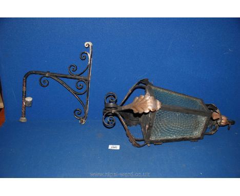 An old wrought iron Porch lantern and bracket.