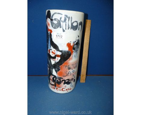 A ceramic stick stand decorated with a gentleman holding a drink, 13'' tall.