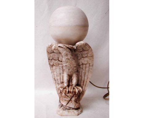 A late 19th century marble sculptural model of an Eagle on a rock, wings outstretched, later converted to a table lamp with g