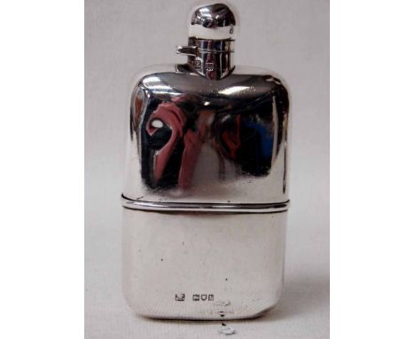 An early 20th century silver Hip Flask of typical form with removable lower sleeve, hinged screw top, London 1918, 4.44oz, 12