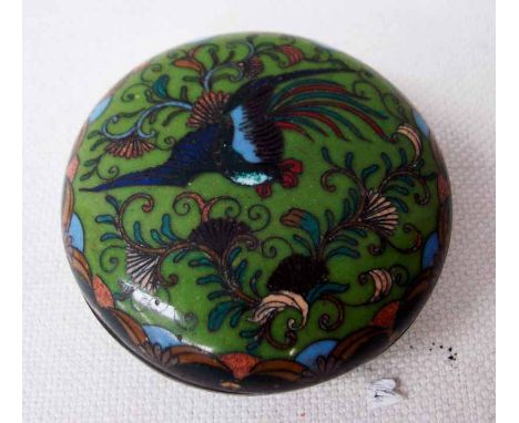 A Japanese cloisonne Lidded Box of circular form decorated with a pheasant amongst foliage on jade green ground, 7cm diameter
