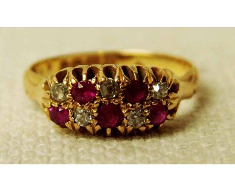 An 18ct gold ruby and diamond Dress Ring, the stones set in two rows of five, ring size M 1/2 