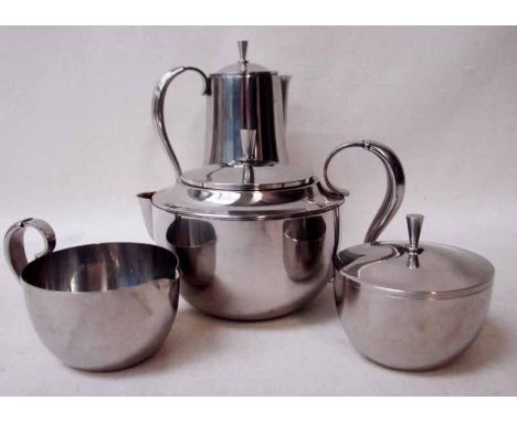 A mid-20th century Danish stainless steel four-piece Tea Service by Georg Jensen, pattern number A4, U form with reeded loop 