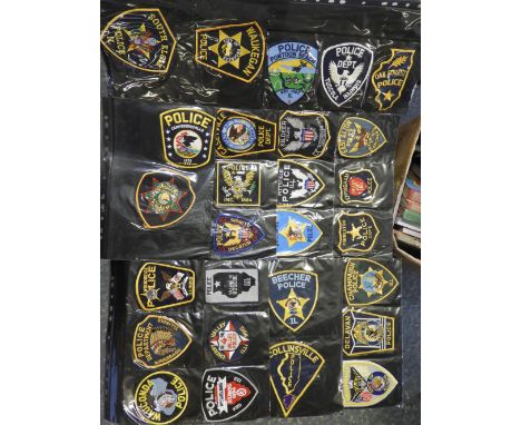 FOLDER OF 78 POLICE FORCE CLOTH PATCH BADGES. ILLINOIS 
