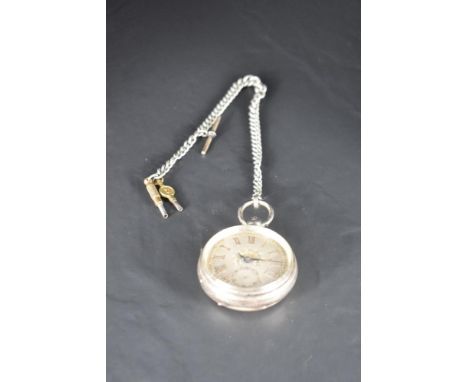 A Victorian silver key wound pocket watch having a Roman numeral dial with subsidiary seconds on a decorative silver dial in 