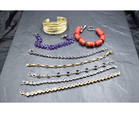 Seven bracelets and an enamelled bangle, all stamped 925, including amethyst, diamante etc