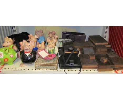 Assorted Natwest piggy banks together with Polaroid cameras and copper printing plates 