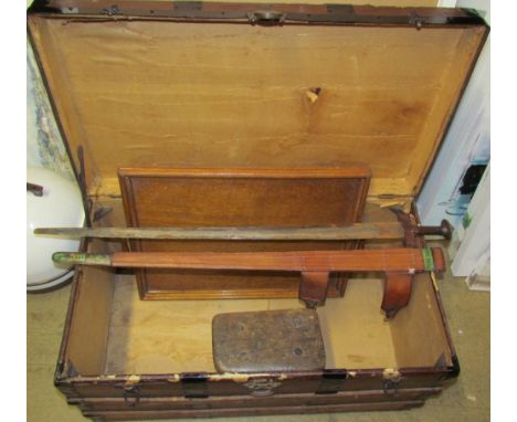 A sword with an iron pommel and leather grip scabbard, together with an oak tray, bound trunk and a milking stool