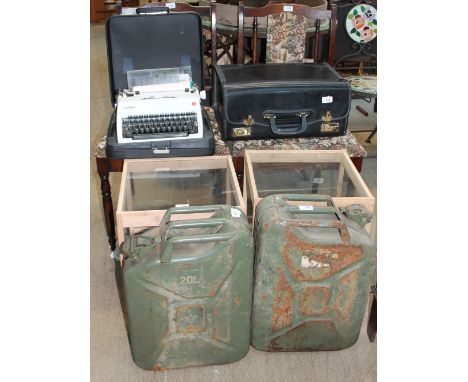 A pair of oak dining chairs together with a table, two fuel cans, a typewriter and briefcase
