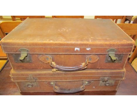 An Army &amp; Navy leather suitcase together with another leather suitcase