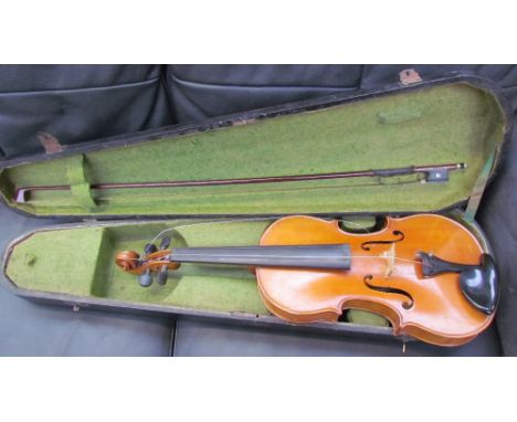 A violin, with a one piece back, bears a label "Dulcis et Fortis", with a bow, cased, back including button 37.5cm, overall 5