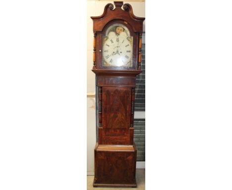 A 19th century mahogany long case clock, the hood with a broken swan neck pediment and turned columns above a short trunk doo