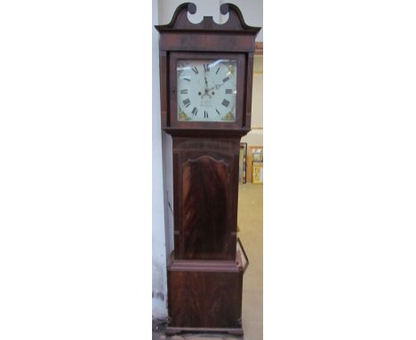 A 19th century mahogany longcase clock, the hood with a broken swan neck pediment above a long trunk door with an arched top,