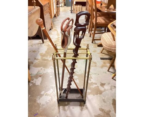 Brass and iron stick stand, together with two walking sticks and a shooting stick (4)