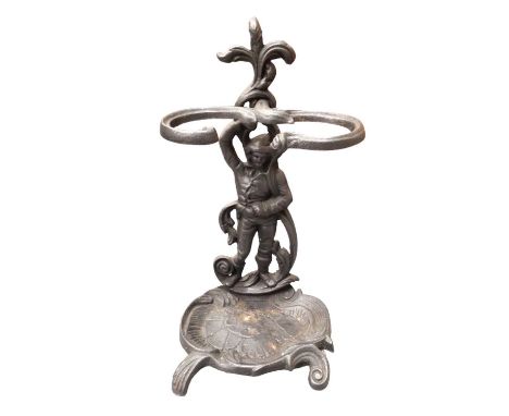 Cast metal stick stand with figure and scroll decoration, 58cm high overall
