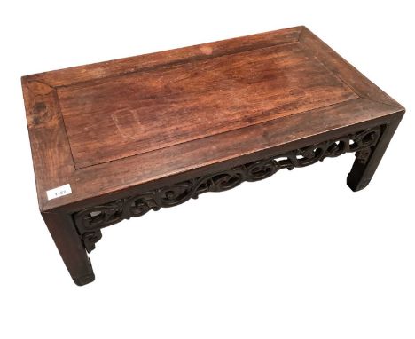 Chinese rosewood low table with pierced scroll sides, on square supports with scroll terminals, 78cm wide x 41cm deep x 29cm 