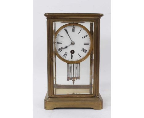 Late 19th century brass four glass mantel clock with mercury pendulum.23cm high