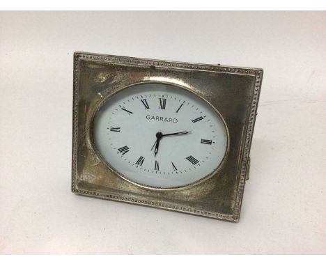 A silver-cased Garrard alarm clock, 11.5cm x 9.5cm