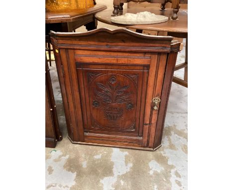 Late Victorian carved walnut corner cupboard, together with a fire screen (2)