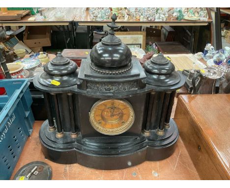 Victorian mantel clock with French 8 day striking movement in a temple shaped black slate case