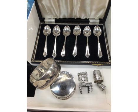 Set of six silver coffee spoons in fitted case, miniature silver chair, white metal trinket pot with animal decoration, white